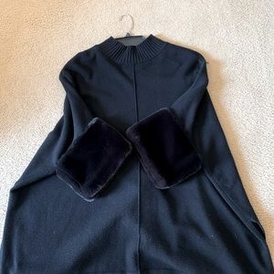 Alfani black poncho with faux fur sleeve cuffs.